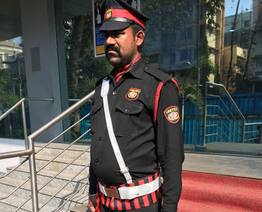 United security guard in uniform at a building entrance